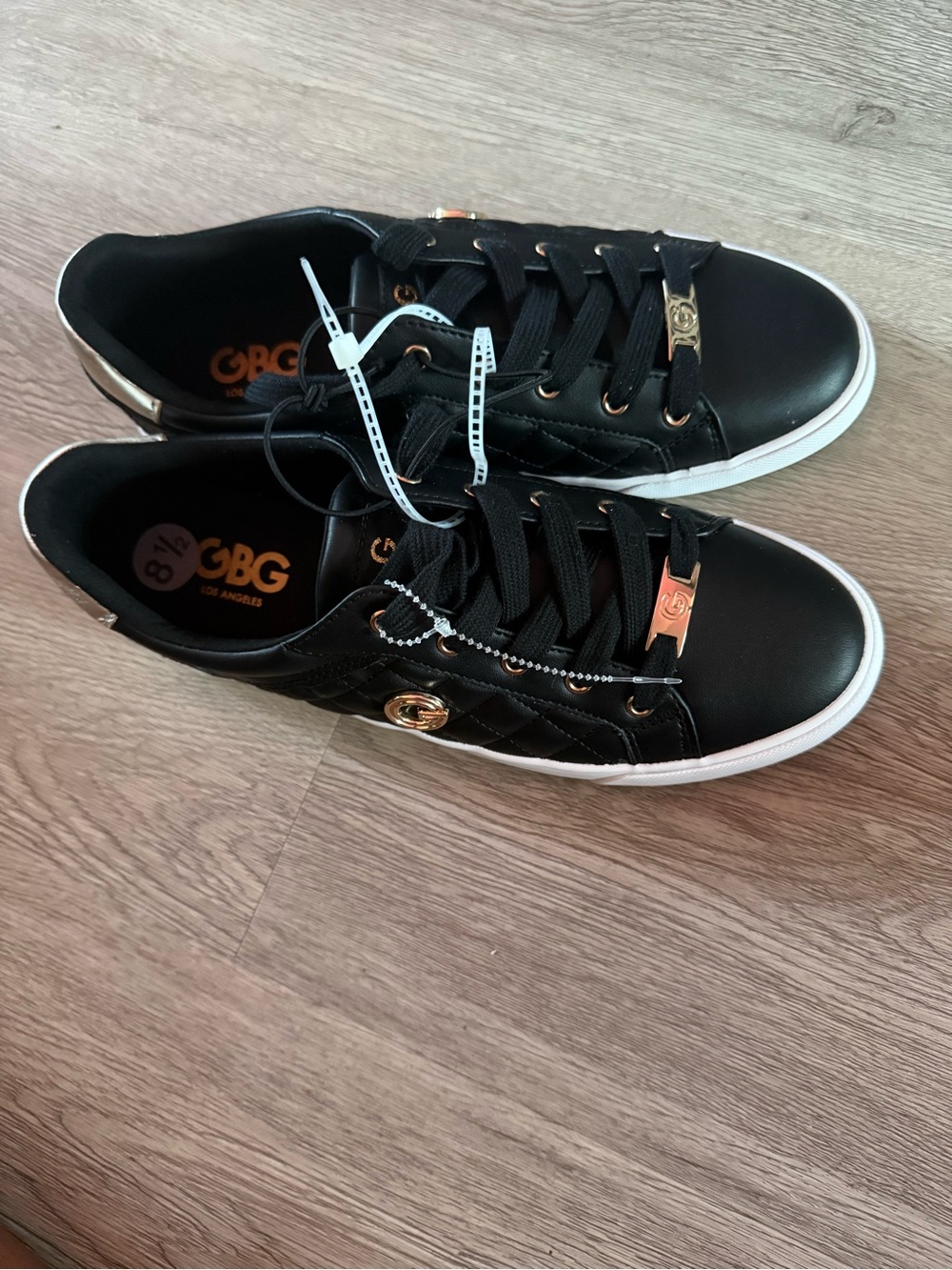 GBG Los Angeles Black Quilted Low-Top Sneakers with Gold Hardware